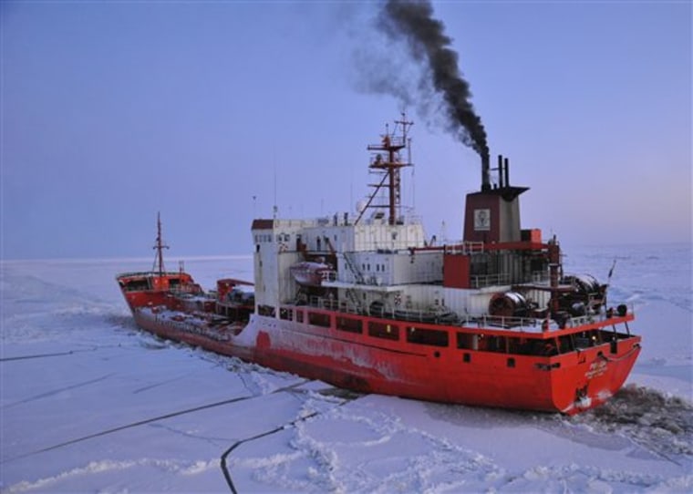 The Coast Guard Cutter Healy escorts the Russian-flagged tanker Renda 250 miles south of Nome Friday Jan. 6, 2012. The vessels are transiting through ice up to five-feet thick in this area. The 370-foot tanker Renda will have to go through more than 300 miles of sea ice to get to Nome, a city of about 3,500 people on the western Alaska coastline that did not get its last pre-winter fuel delivery because of a massive storm. If the delivery of diesel fuel and unleaded gasoline is not made, the city likely will run short of fuel supplies before another barge delivery can be made in spring. (AP Photo/US Coast Guard - Petty Officer 1st Class Sara Francis)